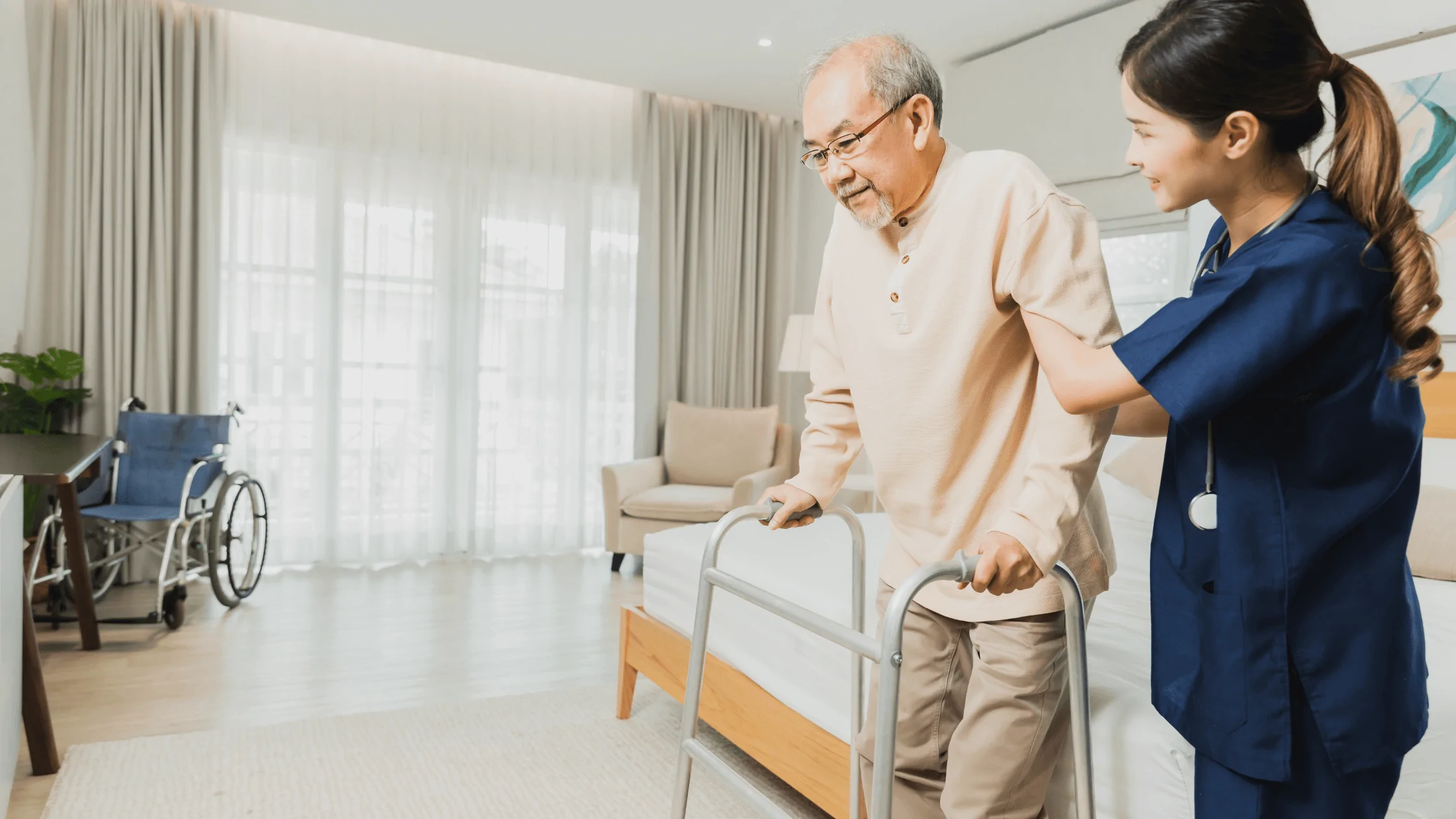 Nurse assisting an elderly patient with a walker, illustrating the use of essential medical equipment for mobility at home.